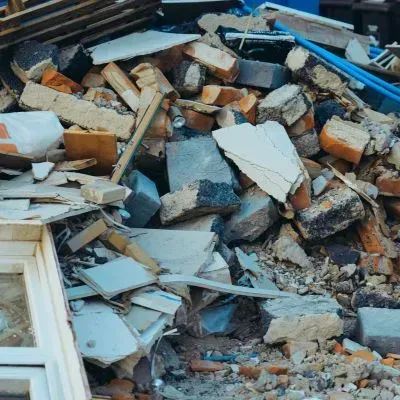 Mixed construction debris, including bricks and timber, is ready for removal in Caversham, Dunedin.