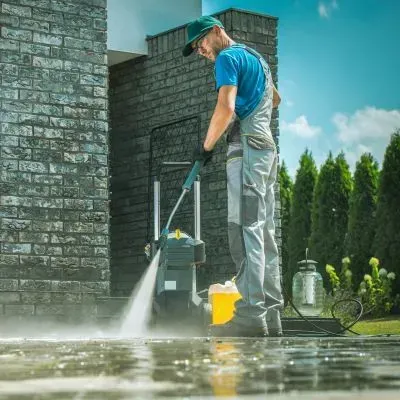 Professional pressure washing of a residential surface in Dunedin using safe and council-compliant cleaning practices.