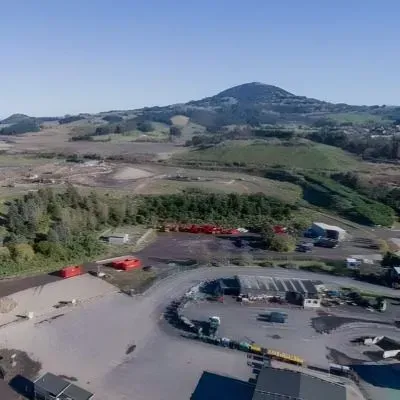 Aerial view of Green Island landfill in Dunedin showing waste management and surrounding land use.