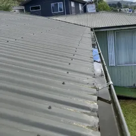After: Gutter fully cleared of grass and debris after gutter cleaning, Kaikorai Valley, Dunedin.