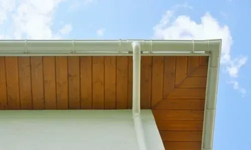 A well-maintained one-storey gutter and downpipe showing clean spouting and proper drainage in Dunedin.
