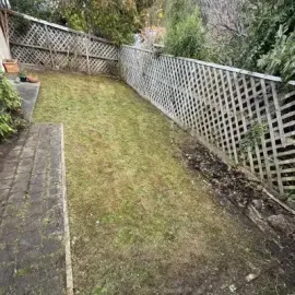 After: Lawn mowing and edging job of a backyard in St. Clair.