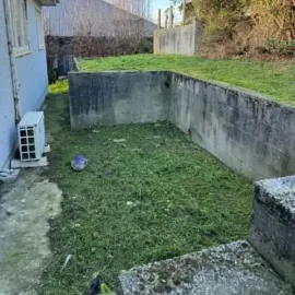 After: Lawn and edges trimmed around retaining walls at a Kaikorai, Dunedin property.