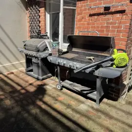 After: Couch was disposed of, resulting in a tidy courtyard with weed removal from the foundation, North Dunedin, Dunedin.