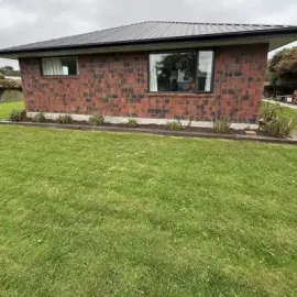After: Removal of flax bushes and garden bed tidy up.