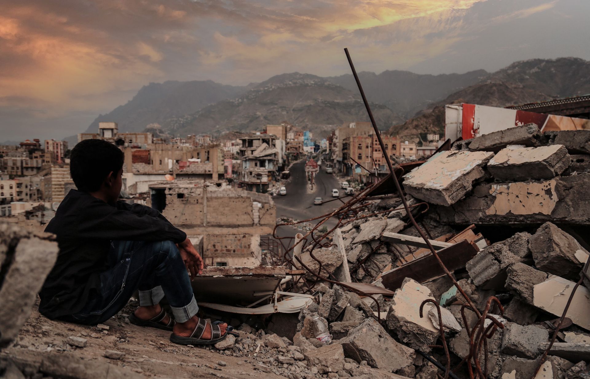War news stories wartorn area with child