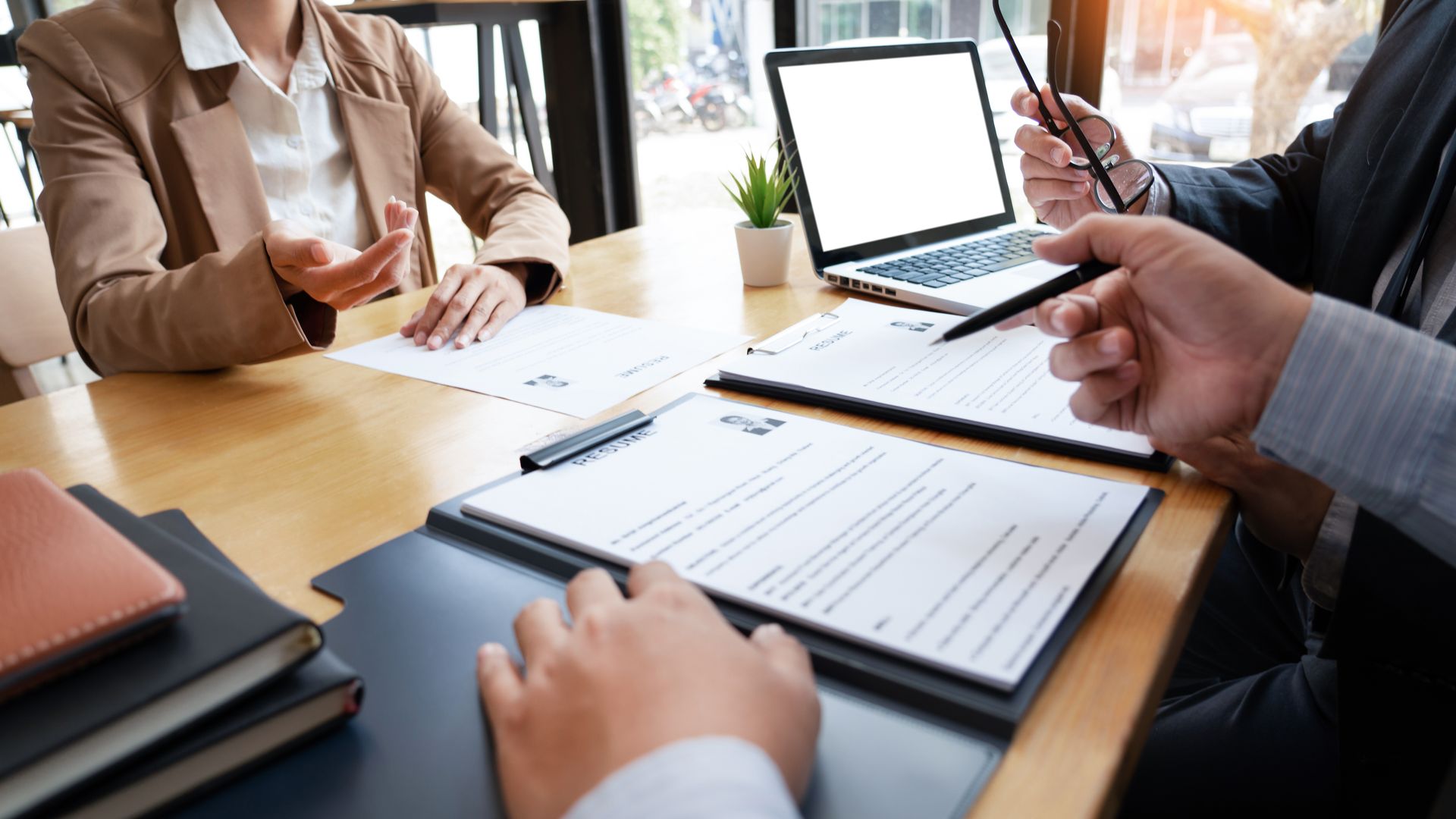 Recruiter reviewing temp agency solutions staffing options with a job candidate