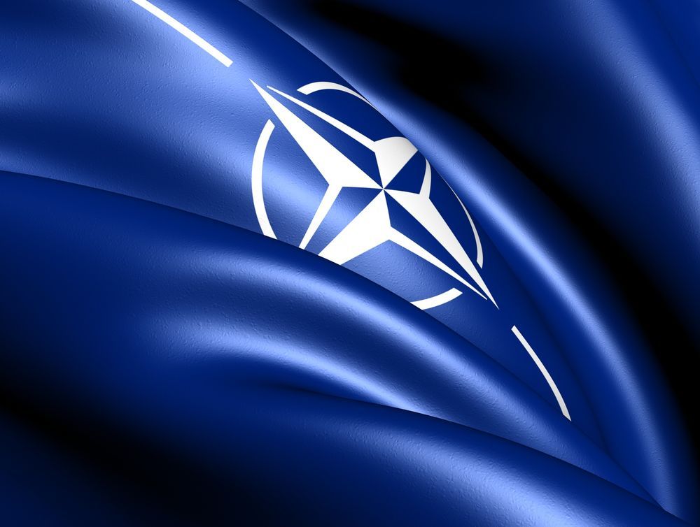 A blue flag with a white star on it.