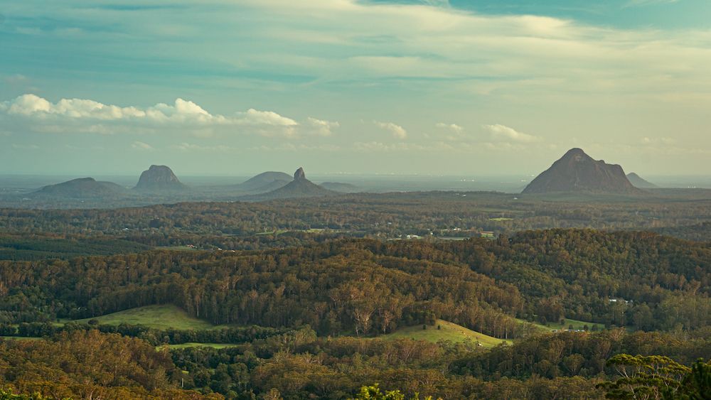 A View of a Valley With Mountains in the Distance and Trees — We Clean Lounges In Beerwah, QLD