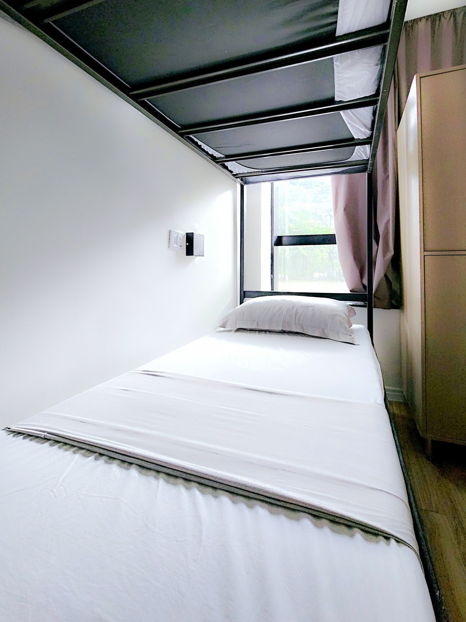 There is a bunk bed in the corner of the room.