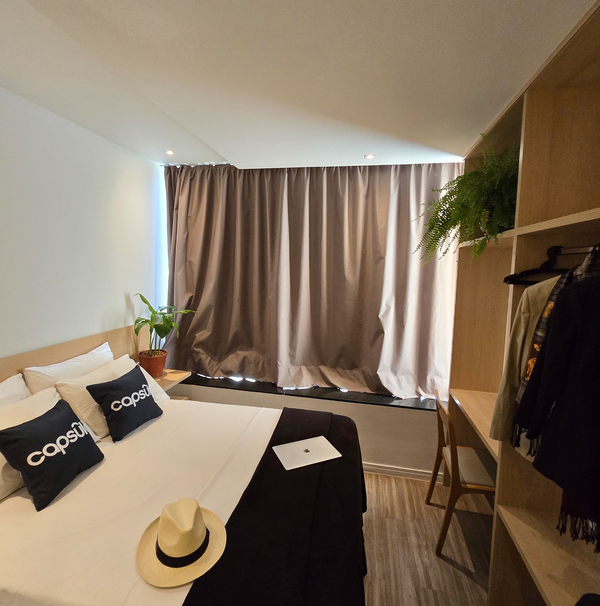 A bedroom with a bed and pillows that say pepsi