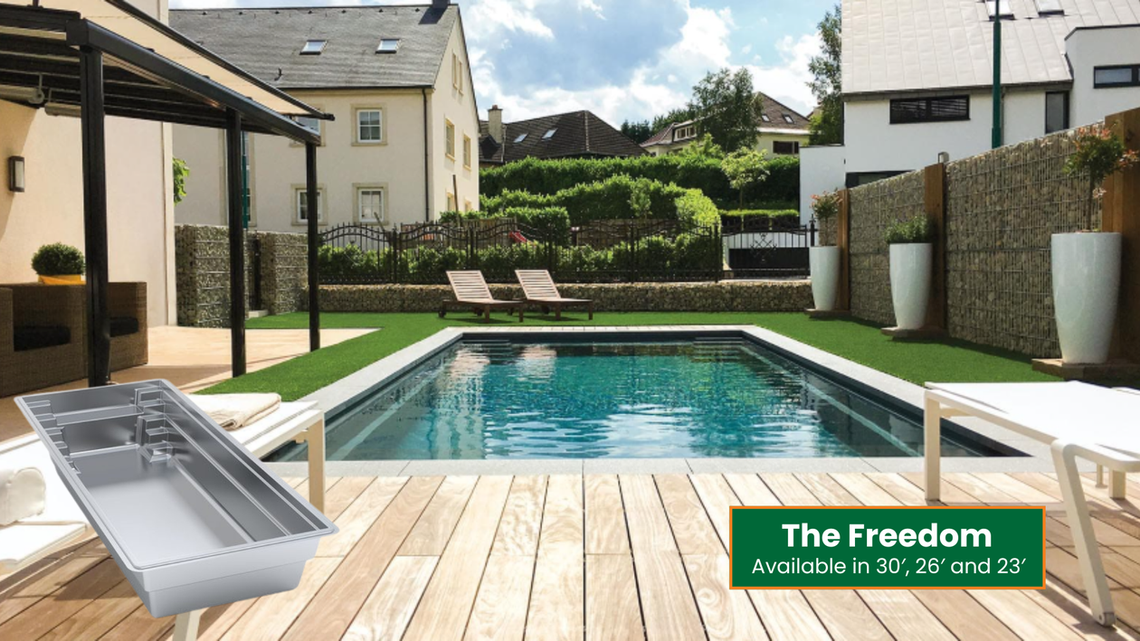 Backyard pool with wooden deck, lounge chairs, and modern houses in the background