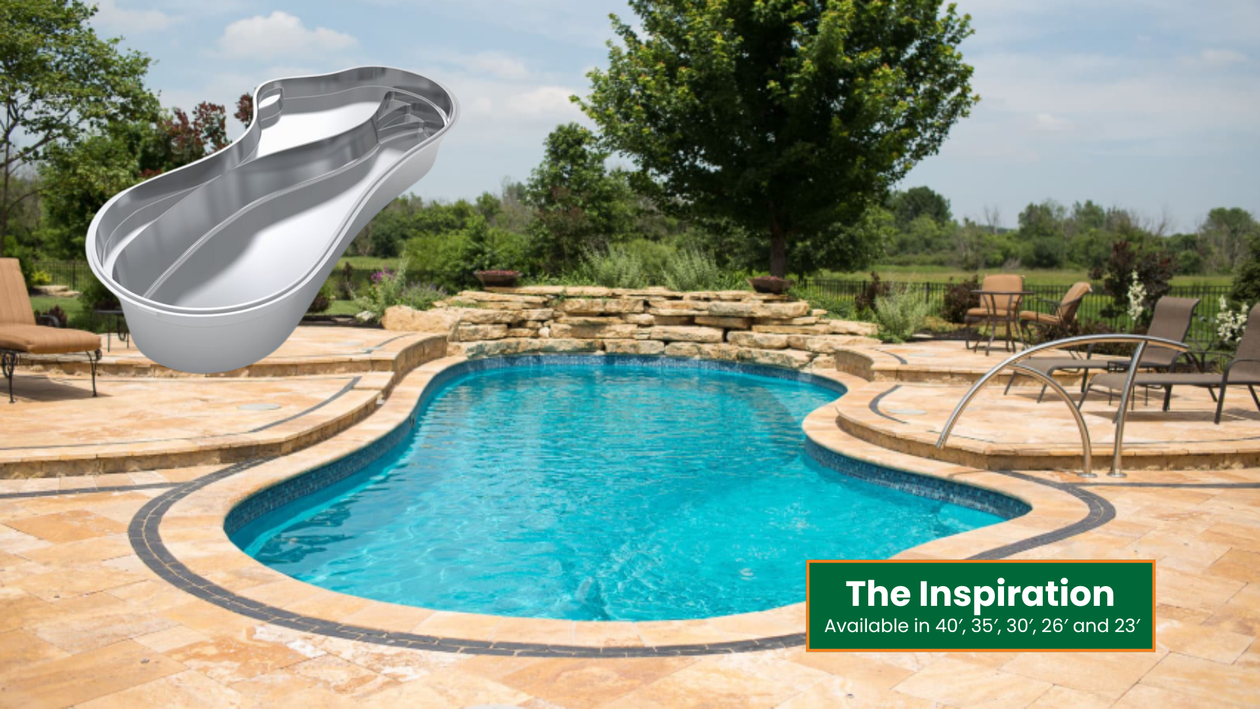 Backyard swimming pool with tan stone deck, patio chairs, and a large slide in a sunny landscape