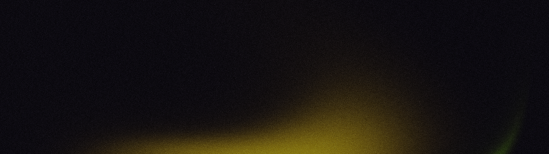 A yellow light is shining on a black background. | Suburban Tire Auto Repair Centers