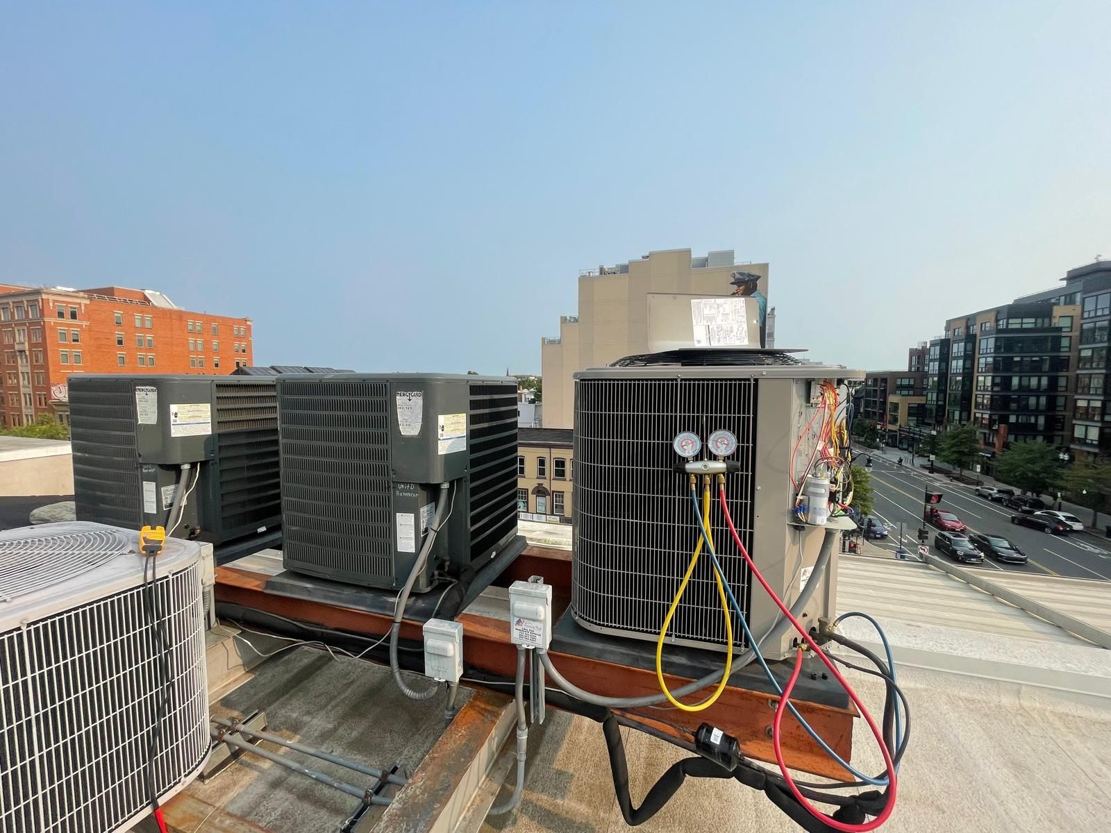 HVAC technician performing commercial system inspection in the DMV