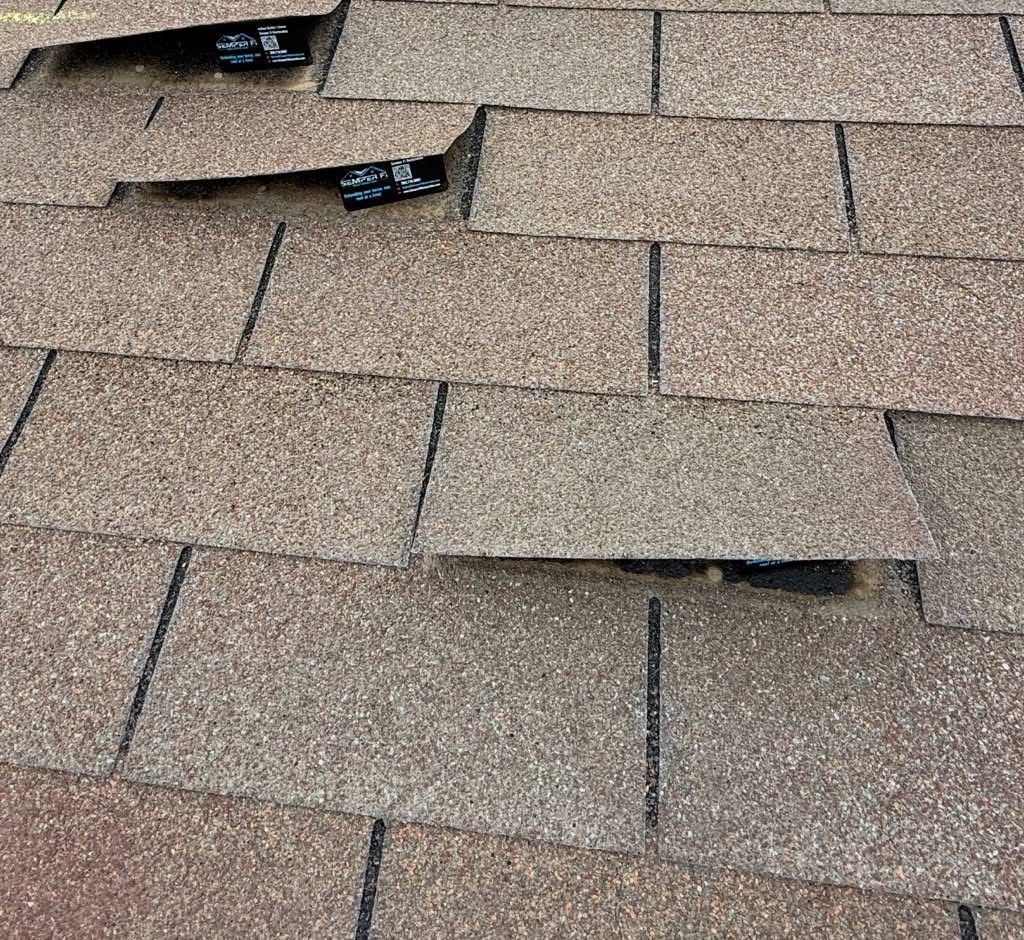 A close up of a roof with a hole in it.
