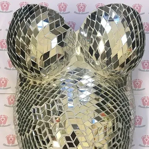 A pregnant woman 's belly is made of mirrors.