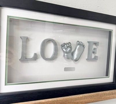 Classic love frame configuration featuring babys hand and foot