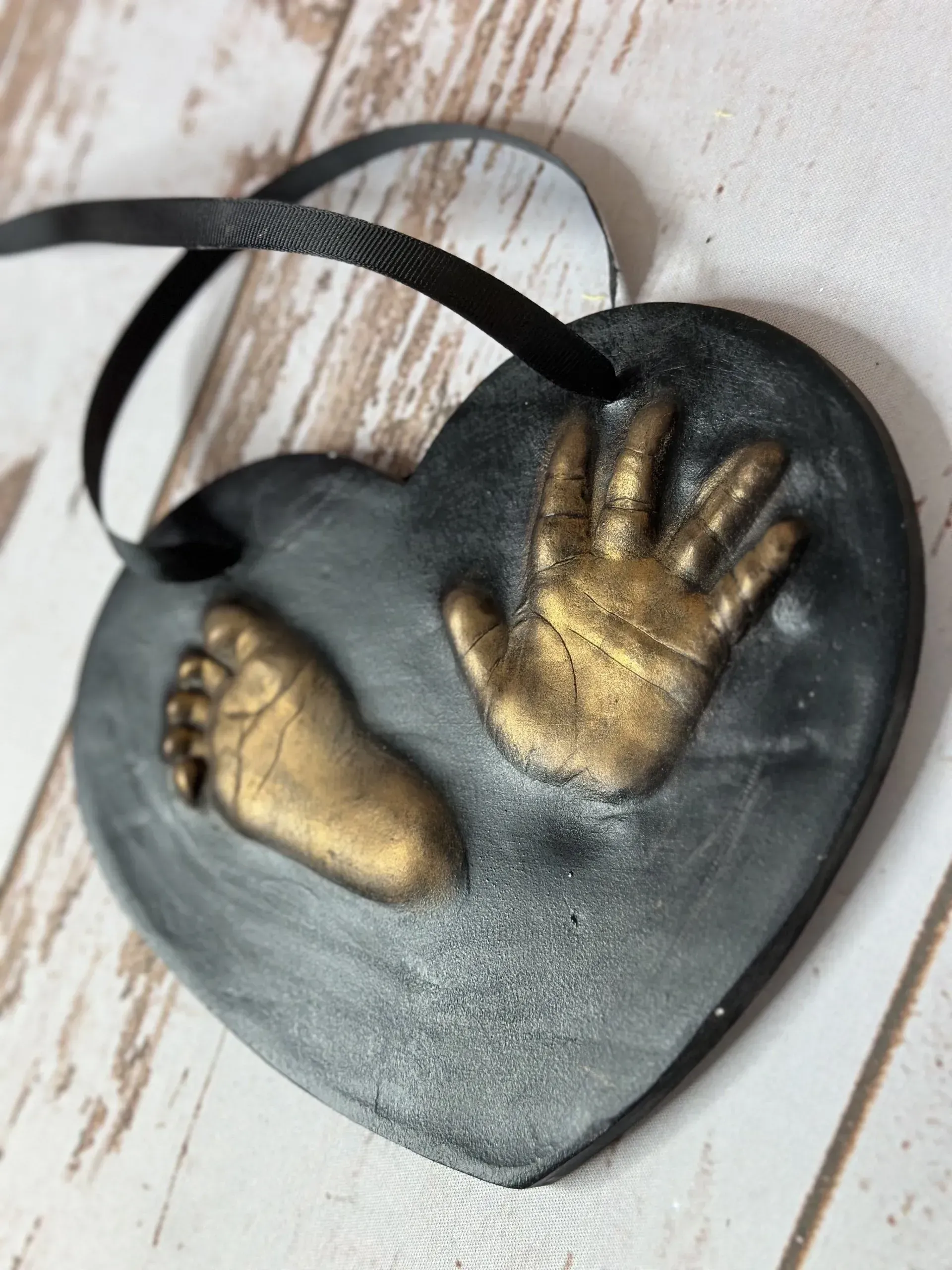 Black outprints finished in gold wax