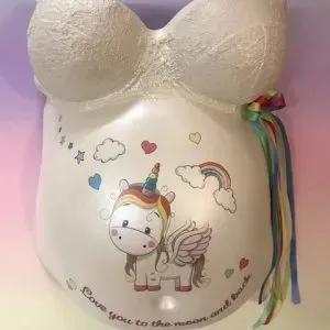 A pregnant belly cast with a unicorn on it.