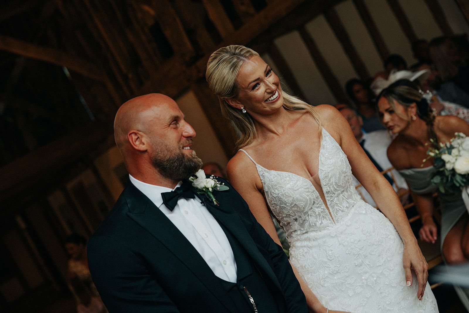 A bride and groom are standing next to each other at their wedding ceremony.