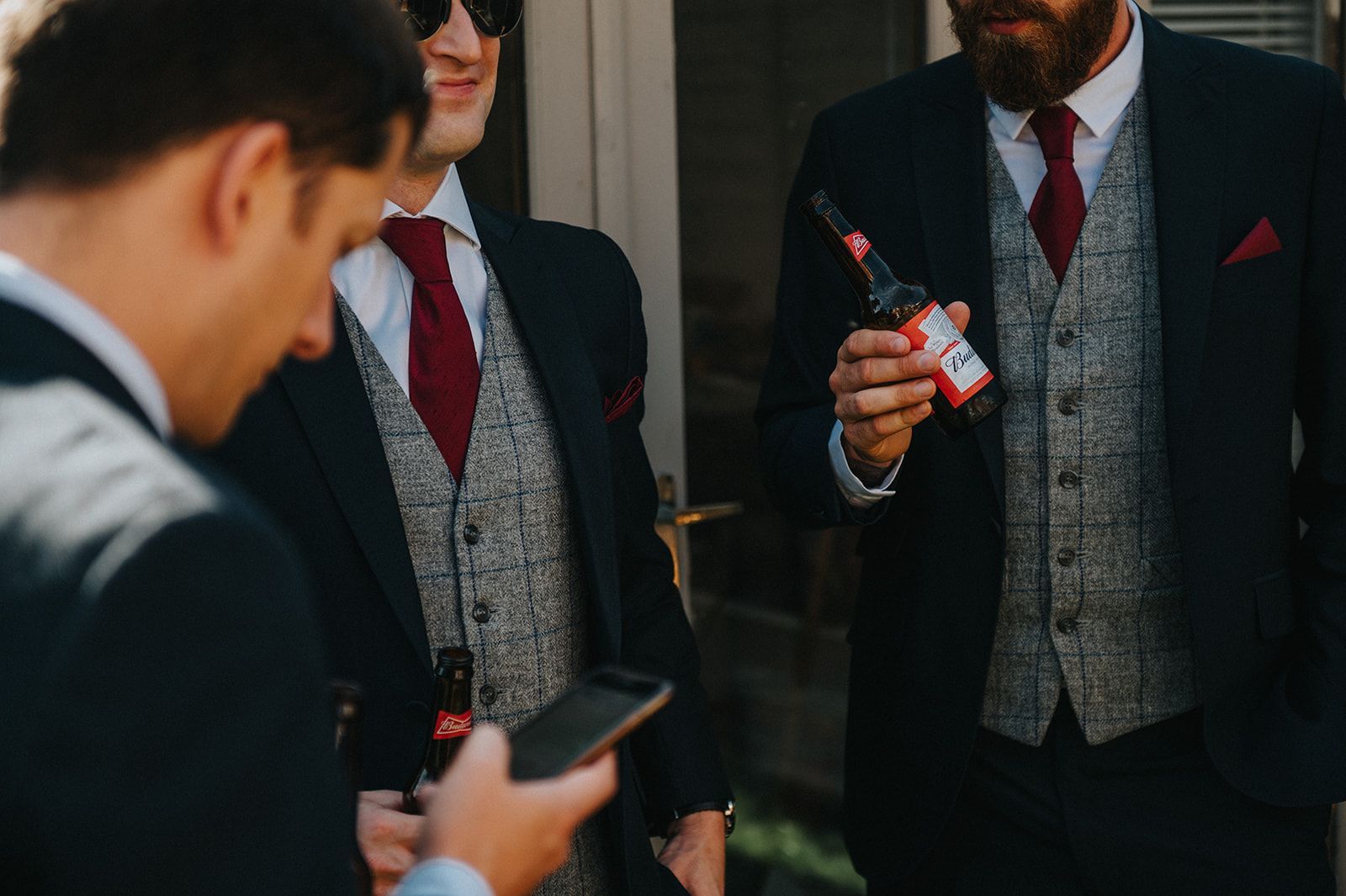 A group of men in suits and ties are standing next to each other.