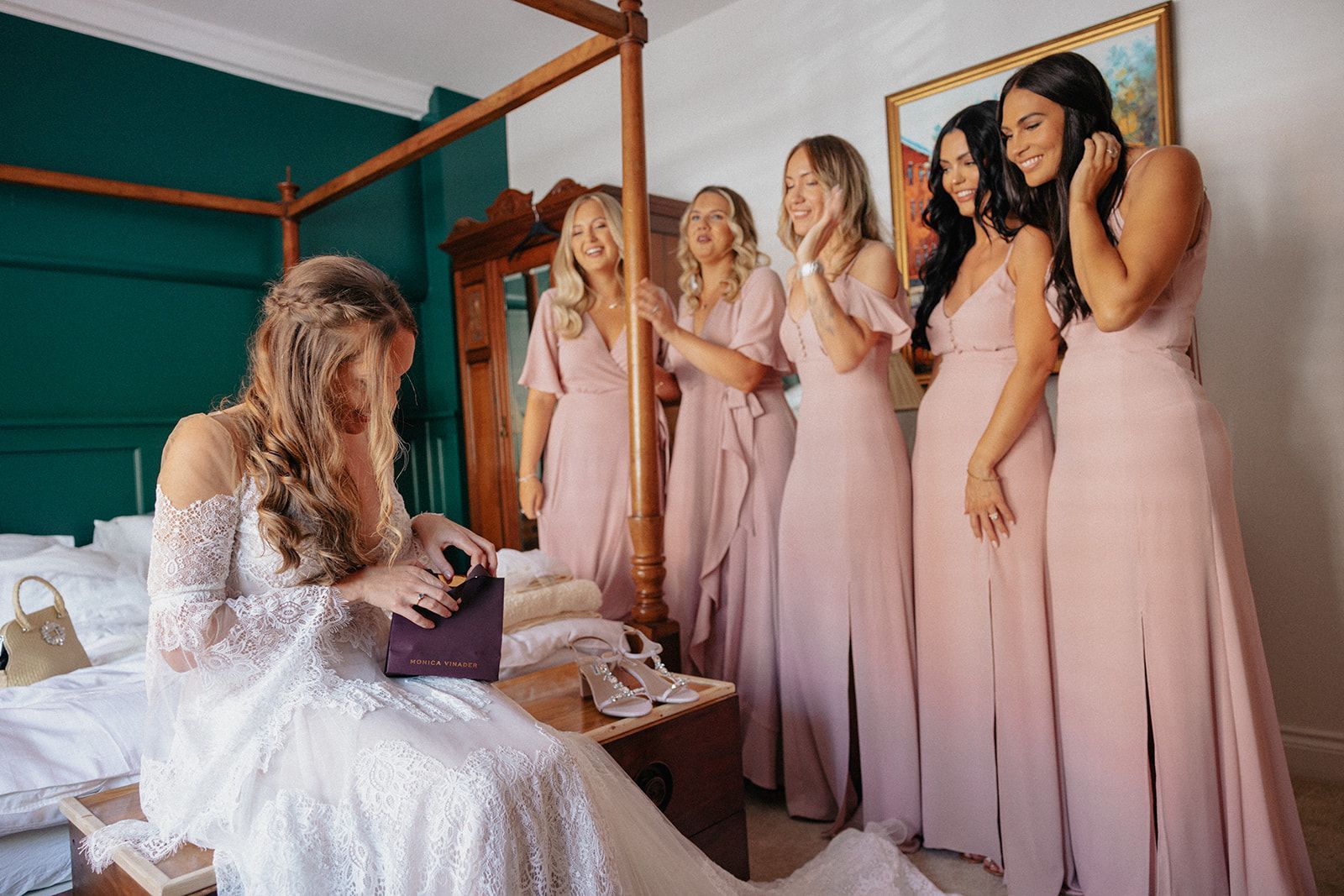 A bride and her bridesmaids are getting ready for her wedding.