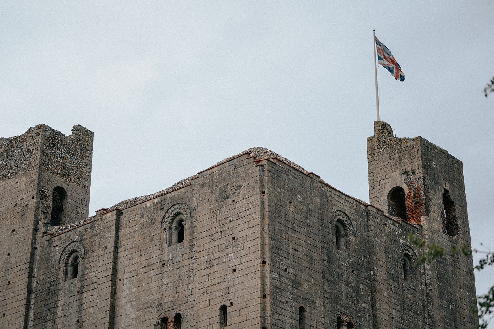 A castle with a flag on top of it