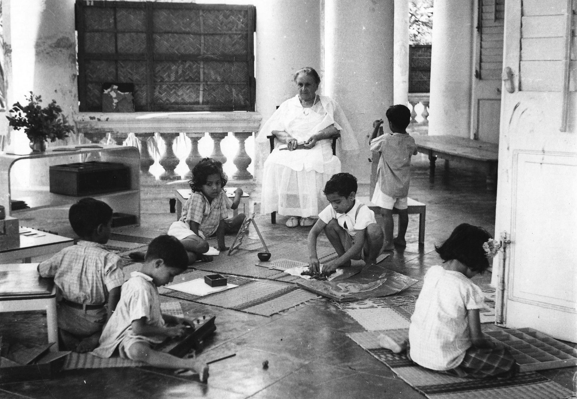 Dr. Maria Montessori observing children