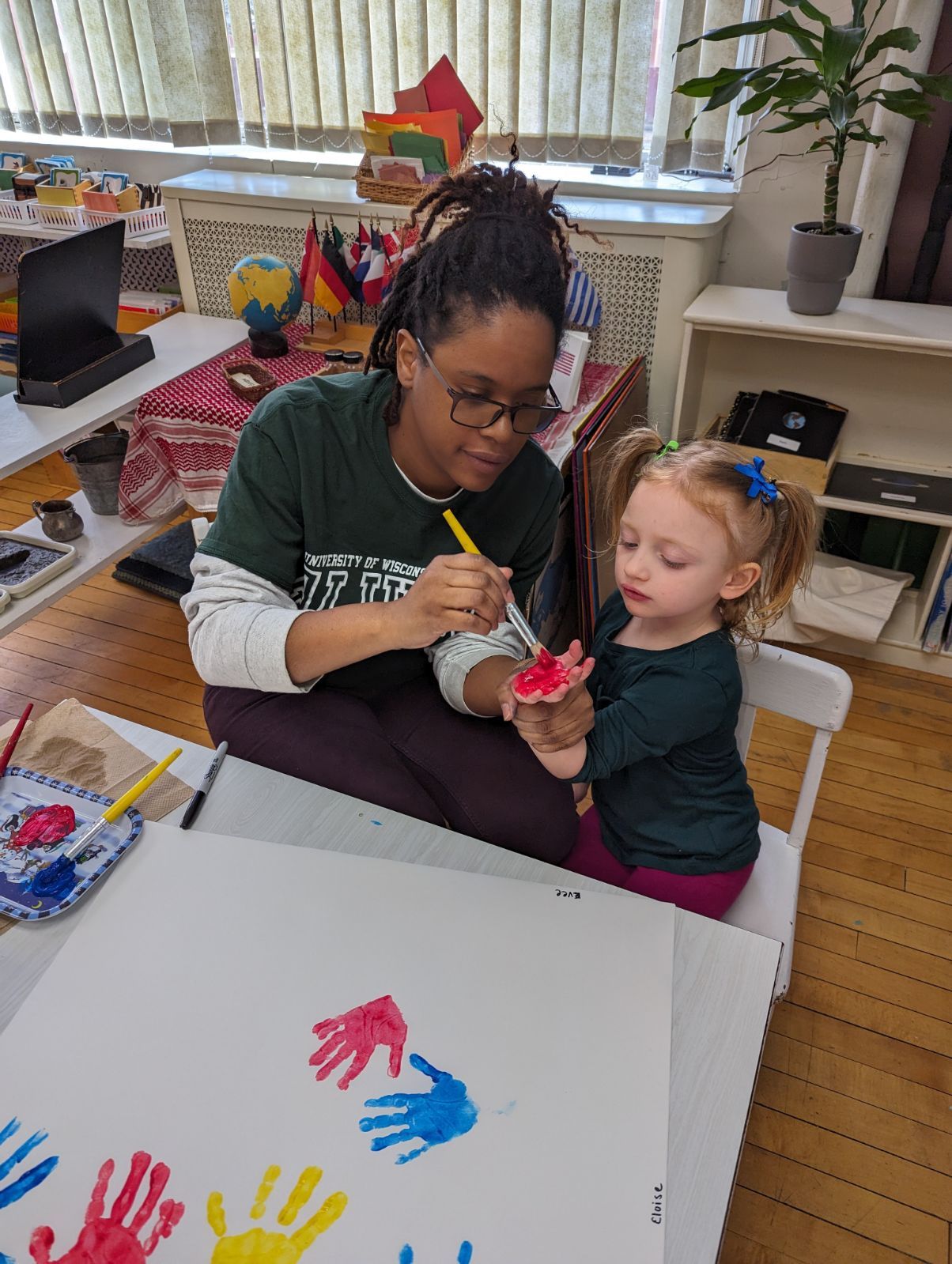 Montessori guide and child during a sensorial lesson