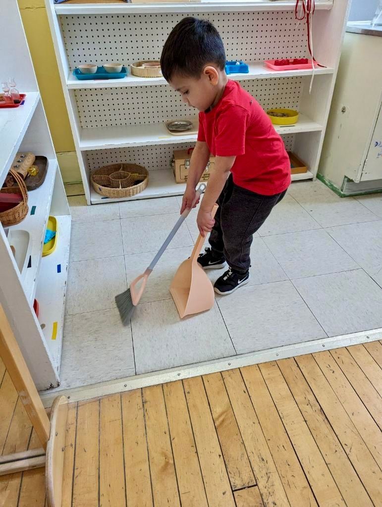 montessori child working on a practical life activity