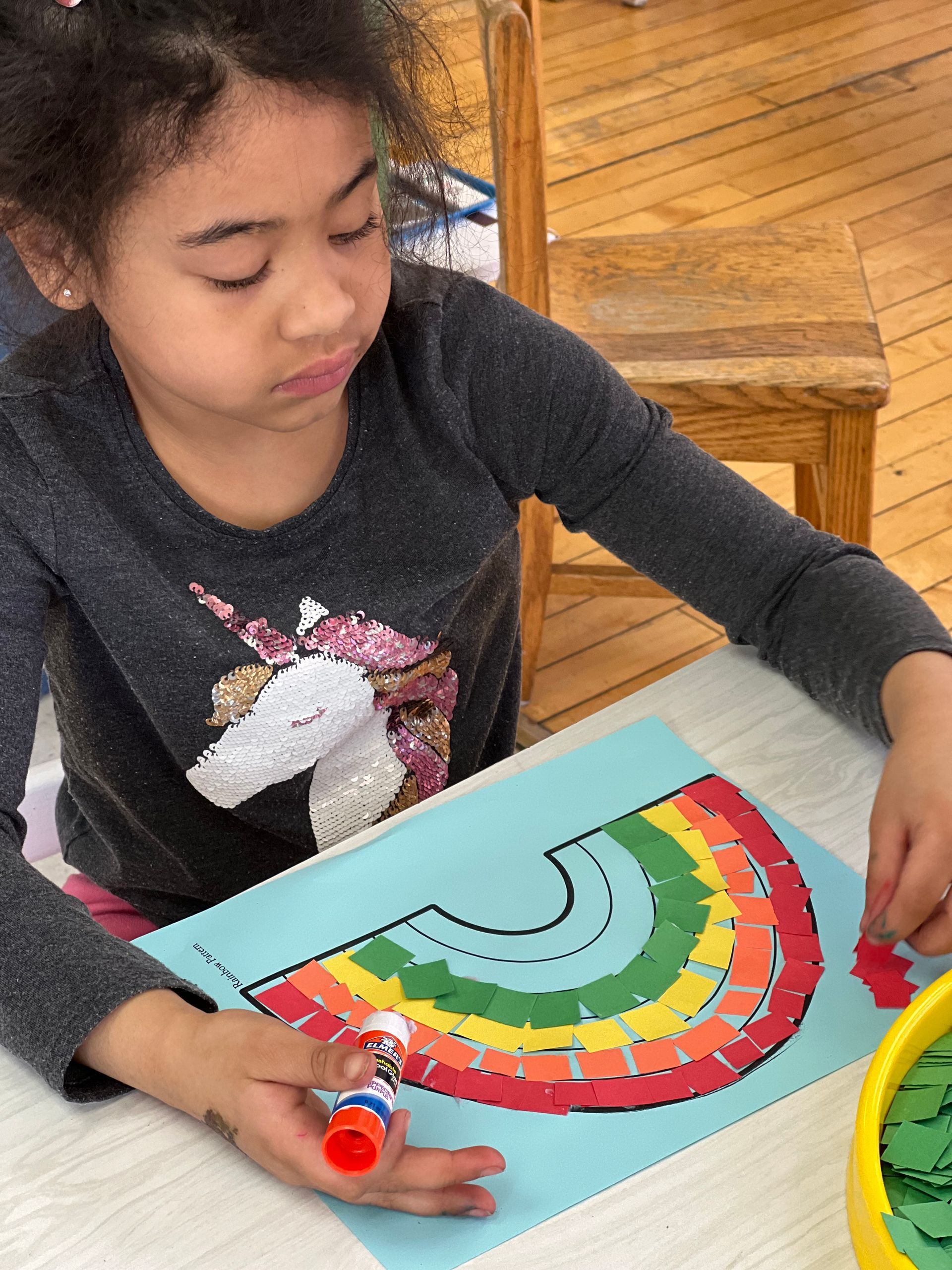 Montessori child working on a craft