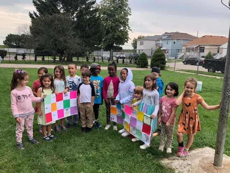 Montessori children engaged in an art activity