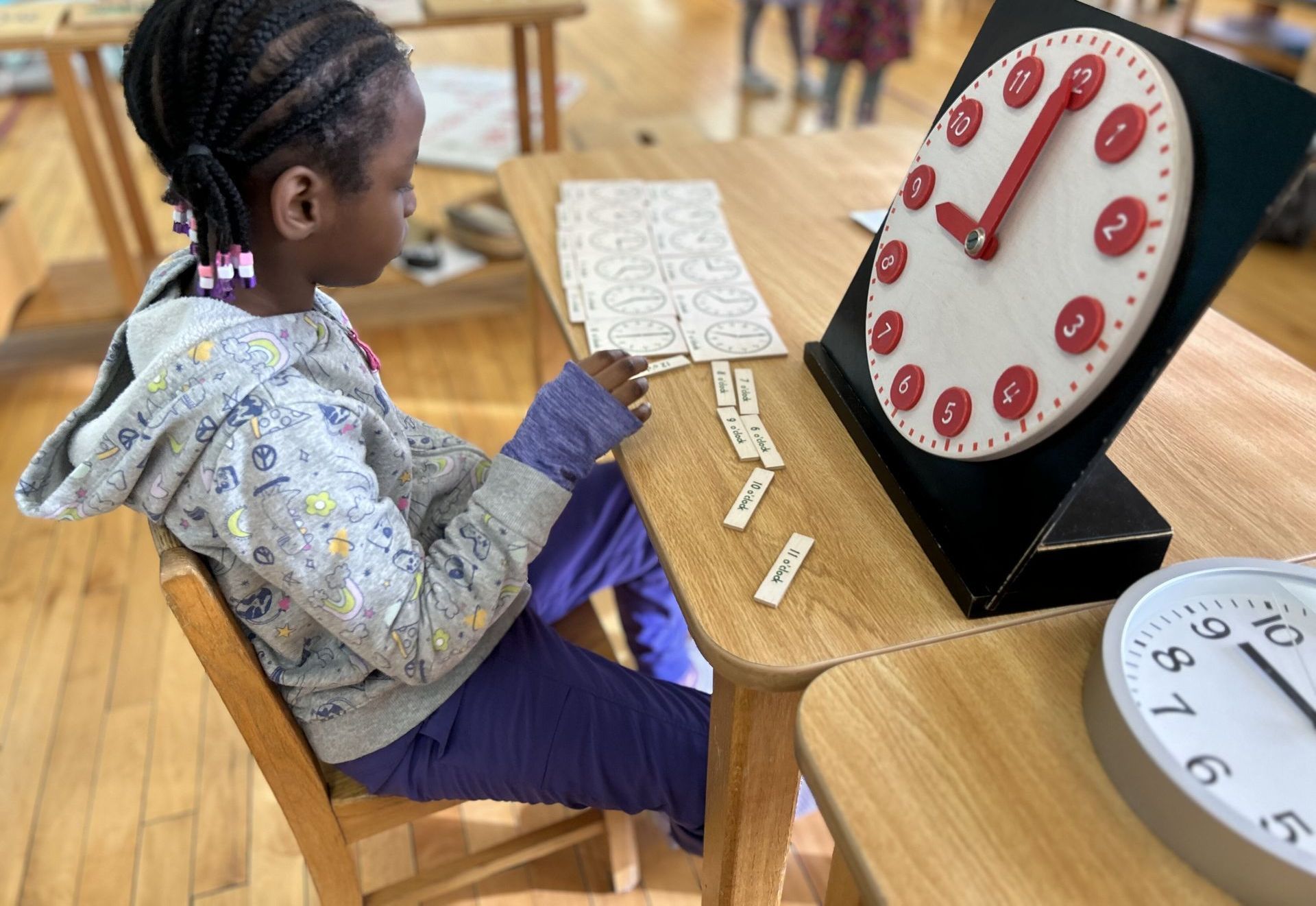 Montessori child working with a wooden puzzle