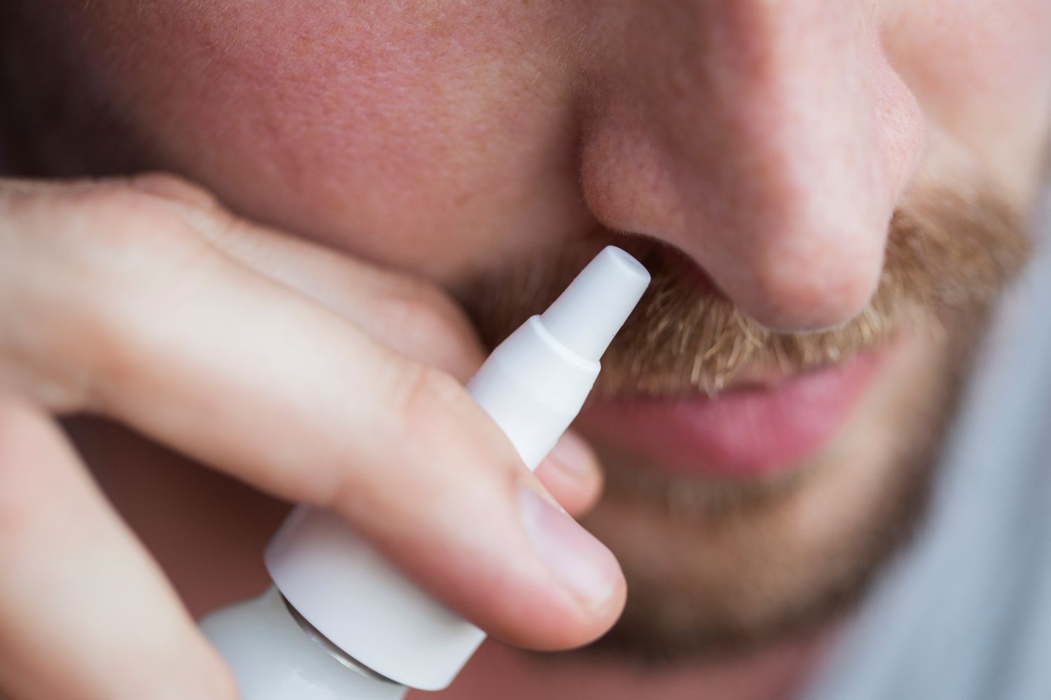 close-up-of-man-using-nasal-moisturizer