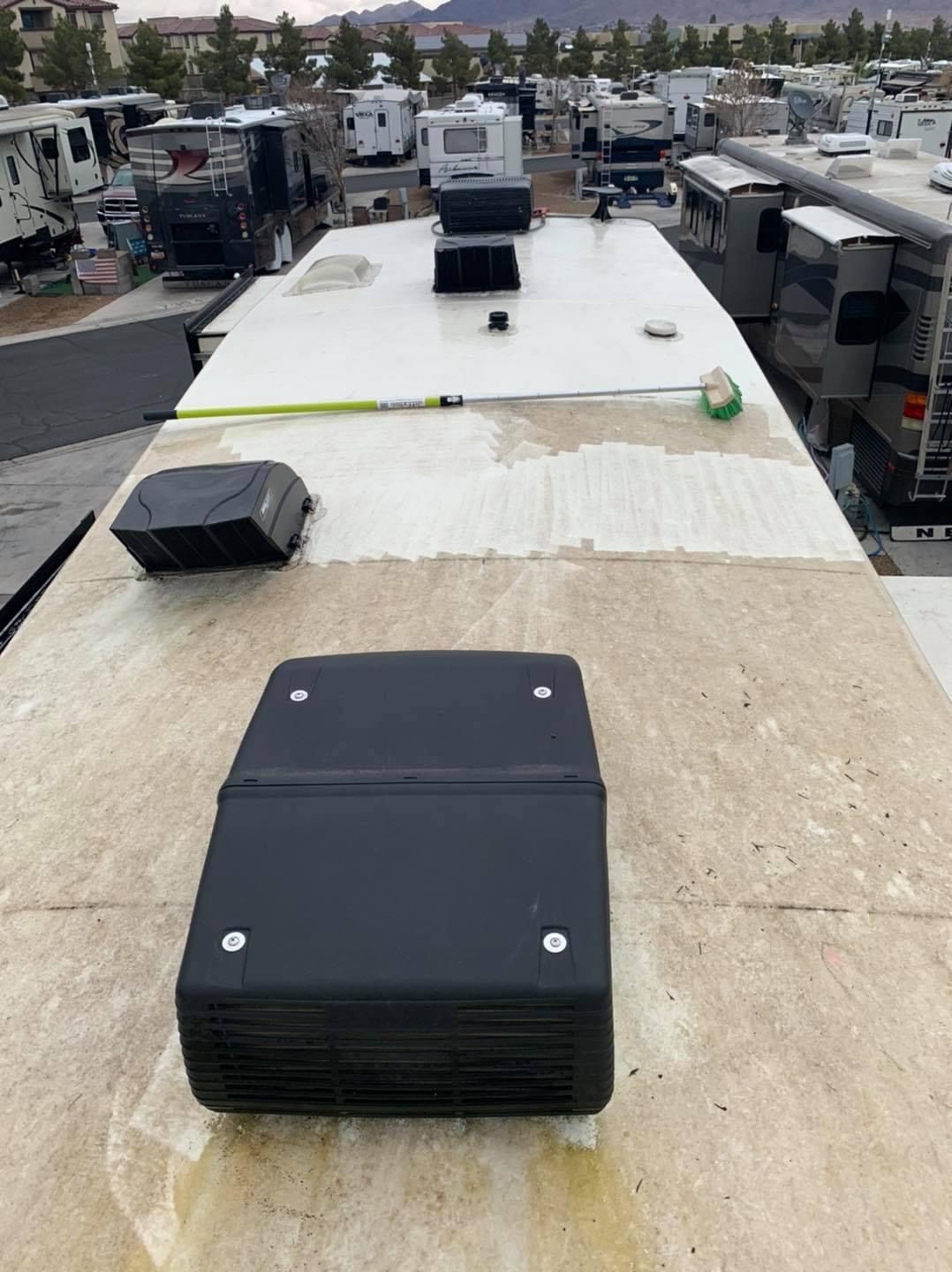 The roof of a rv is being remodeled.