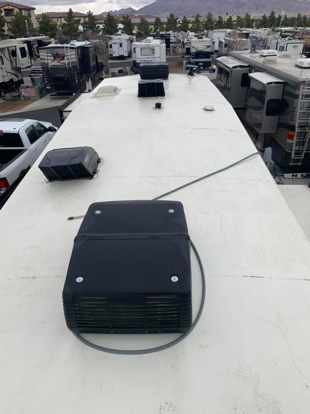 A white roof with a black box on top of it