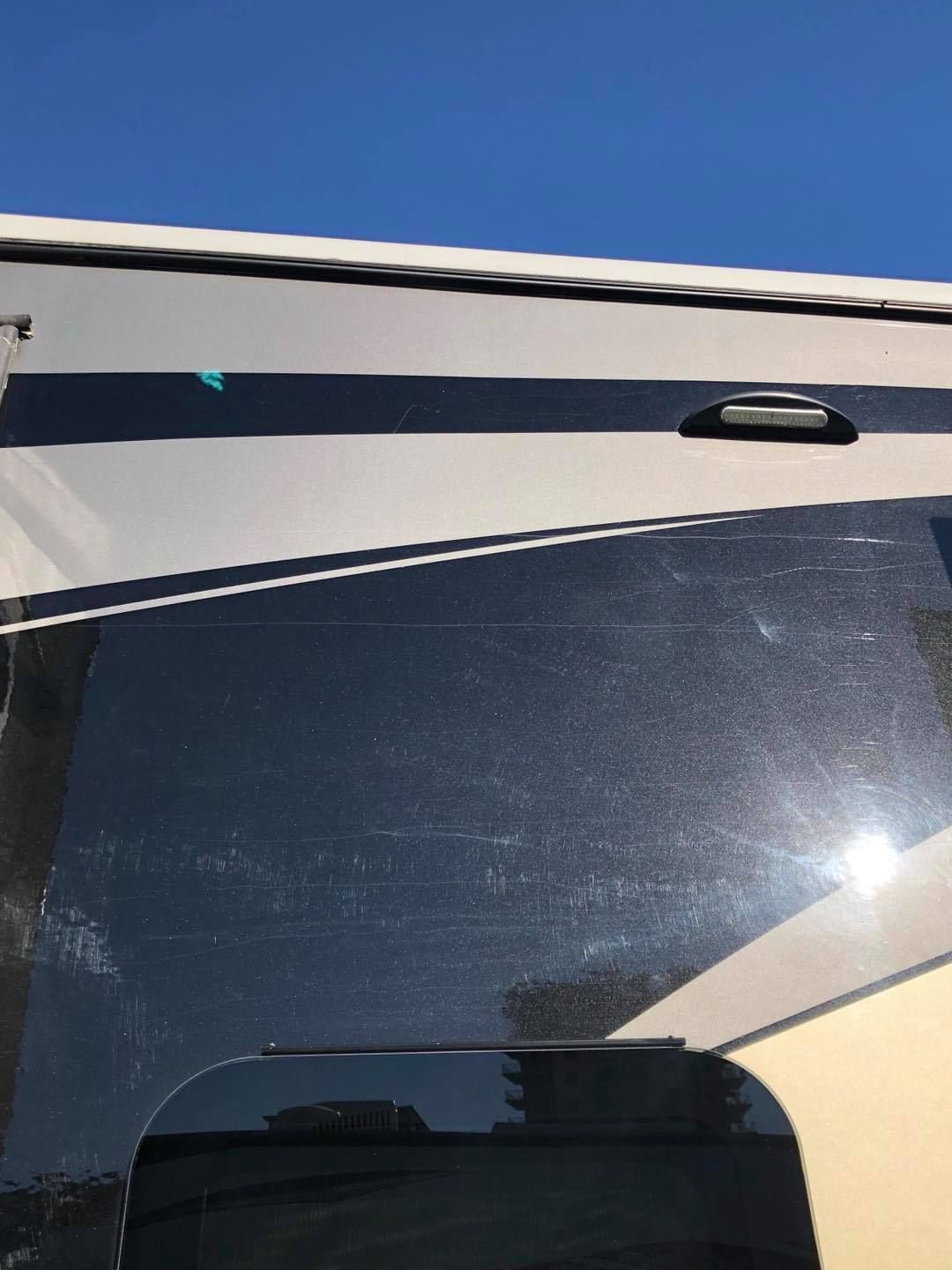 A close up of a car windshield with a blue sky in the background