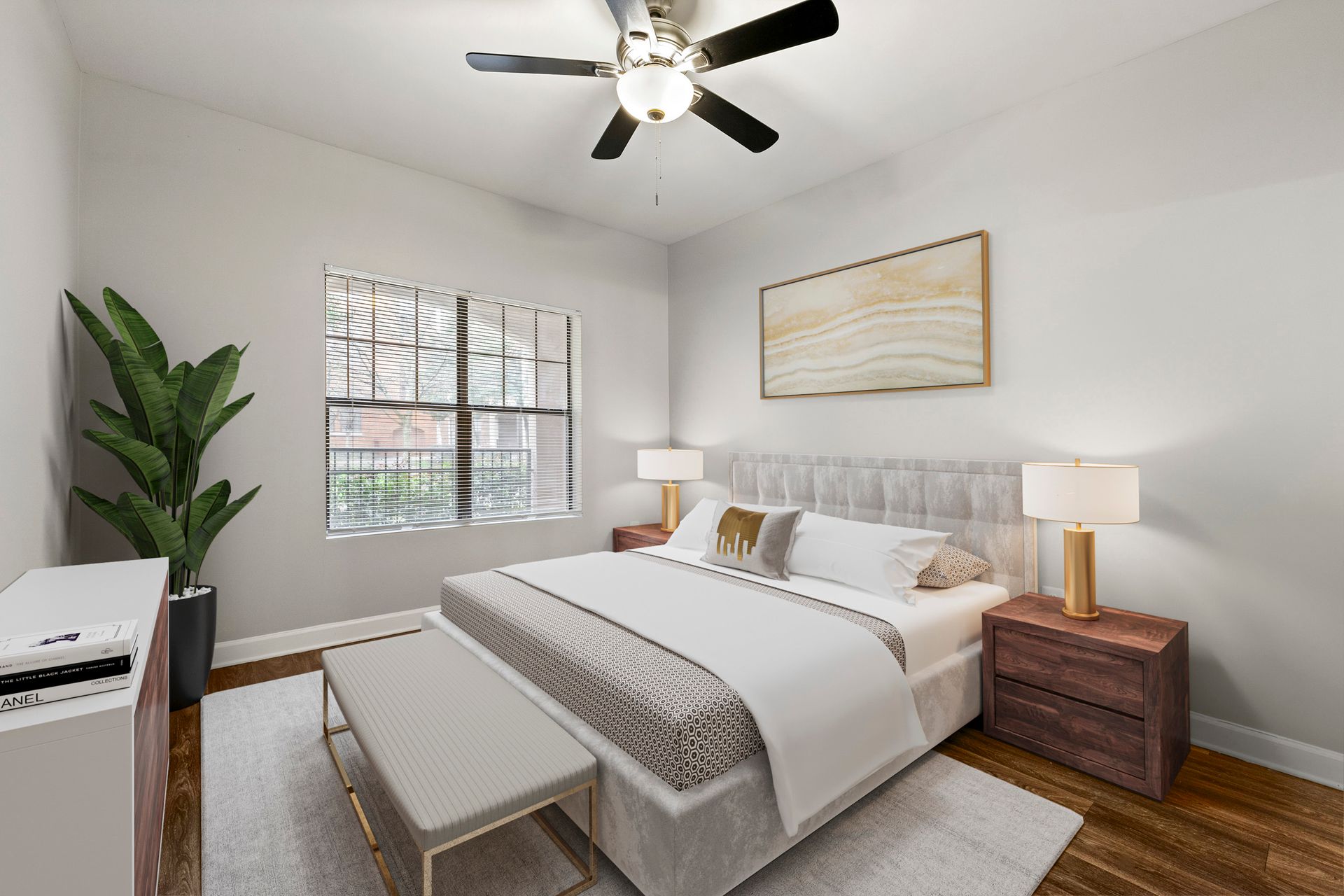 Bright bedroom with a bed, nightstands, lamp, window, ceiling fan, and plant