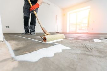 Epoxy being poured by worker male