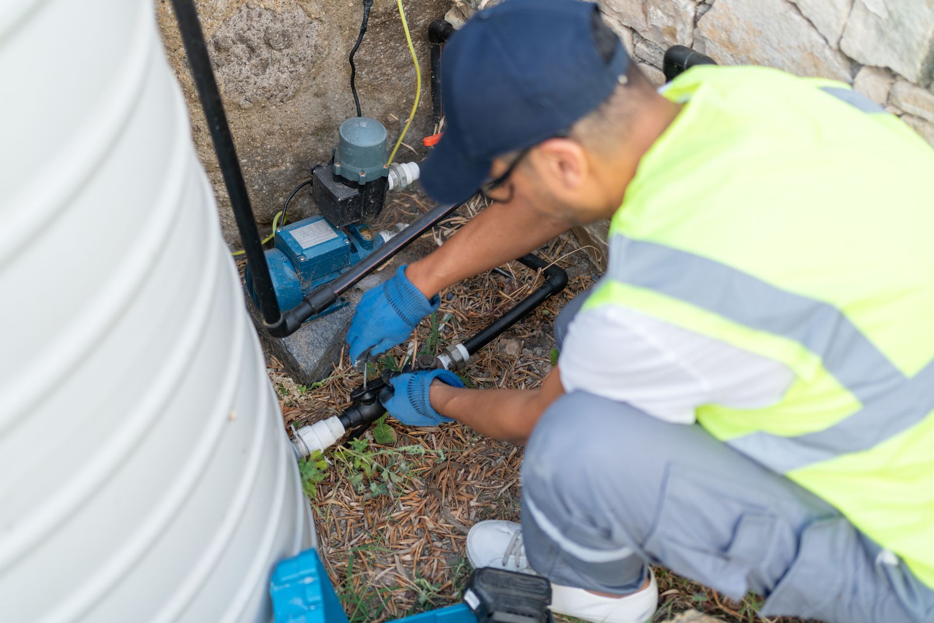 Plumber installing Water Pump Motor