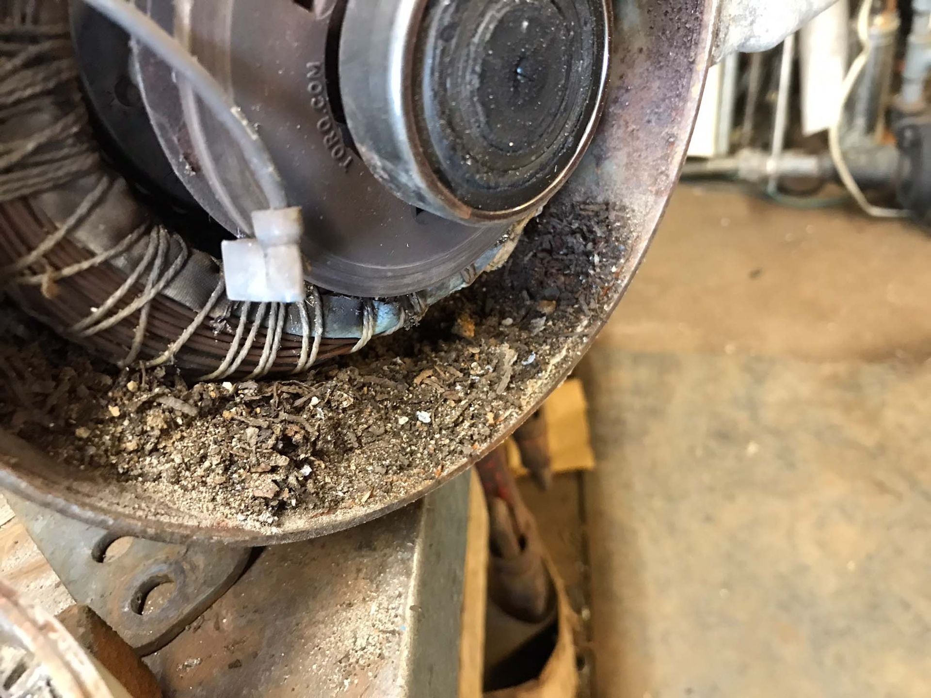 A close up of a machine with a lot of dust on it.