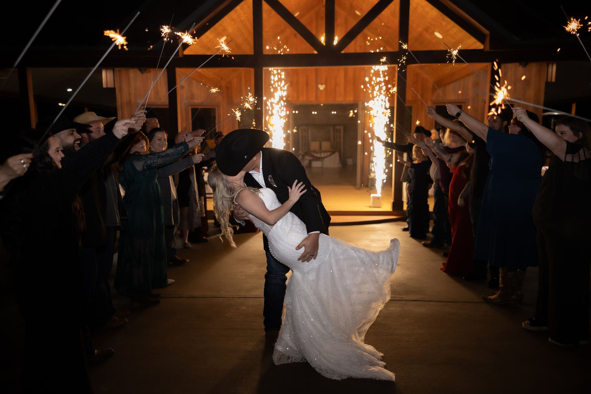 cold spark wedding send off photo from Union Ranch wedding venue in New Waverly, Tx. Cold sparks by DJ Ivan.
