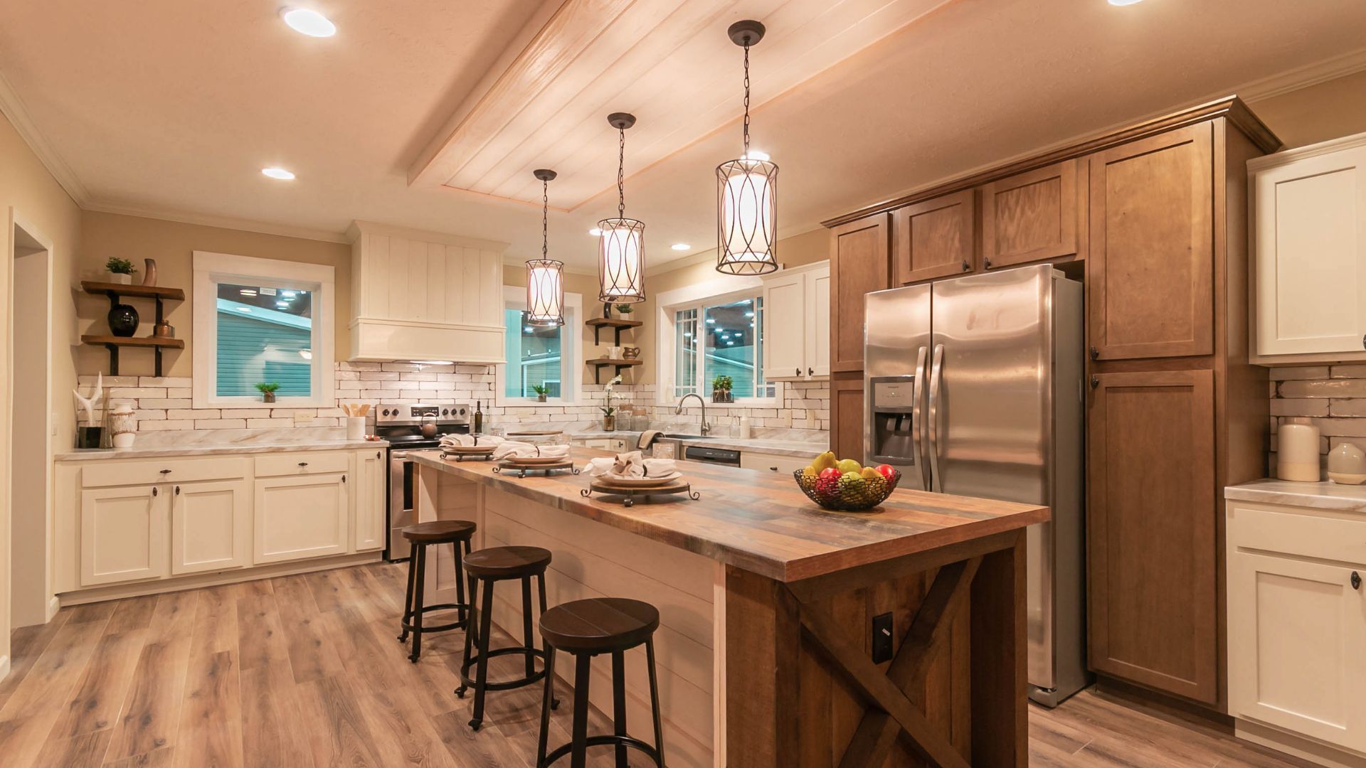 A kitchen with stainless steel appliances and wooden cabinets