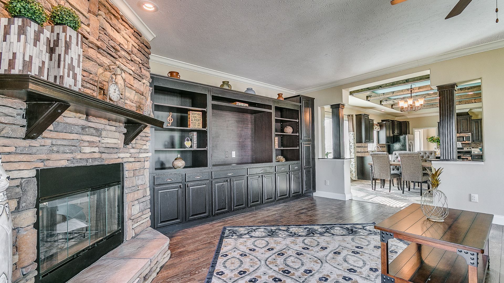 There is a fireplace in the middle of the living room. There is a fireplace in the middle of the living room.