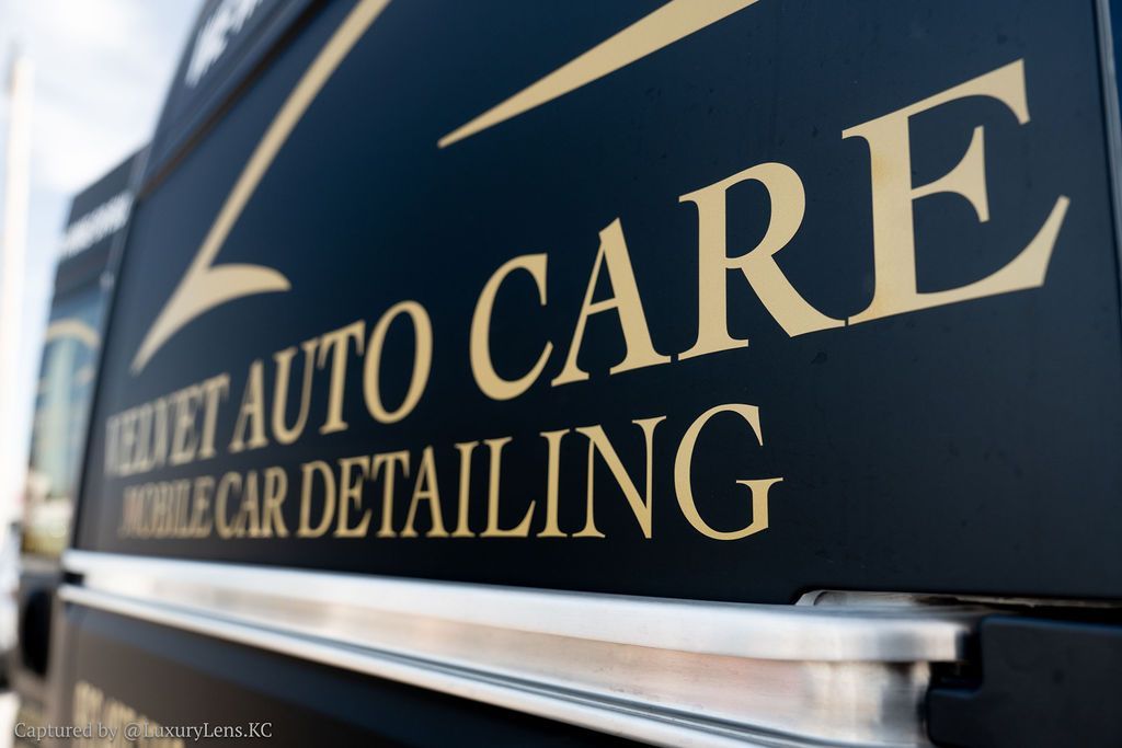 Black vehicle with gold lettering: