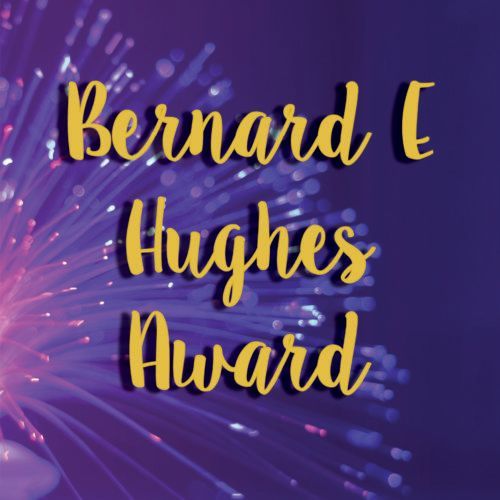 Bernard E Hughes Award in gold script on a purple, abstract light background
