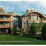 Multi-story lodge with arched roof and balconies beside a green lawn under a cloudy sky