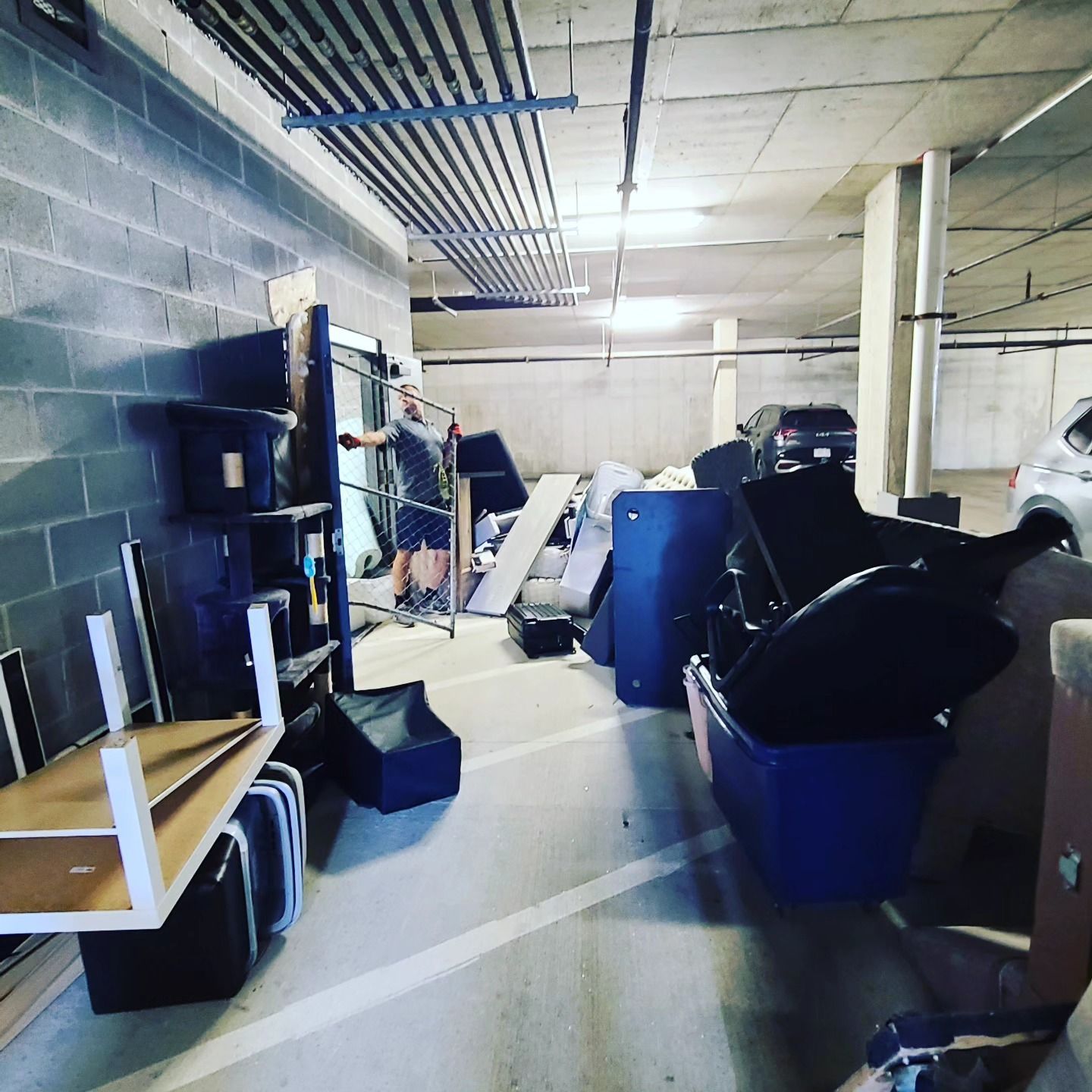 A parking garage filled with lots of furniture and boxes