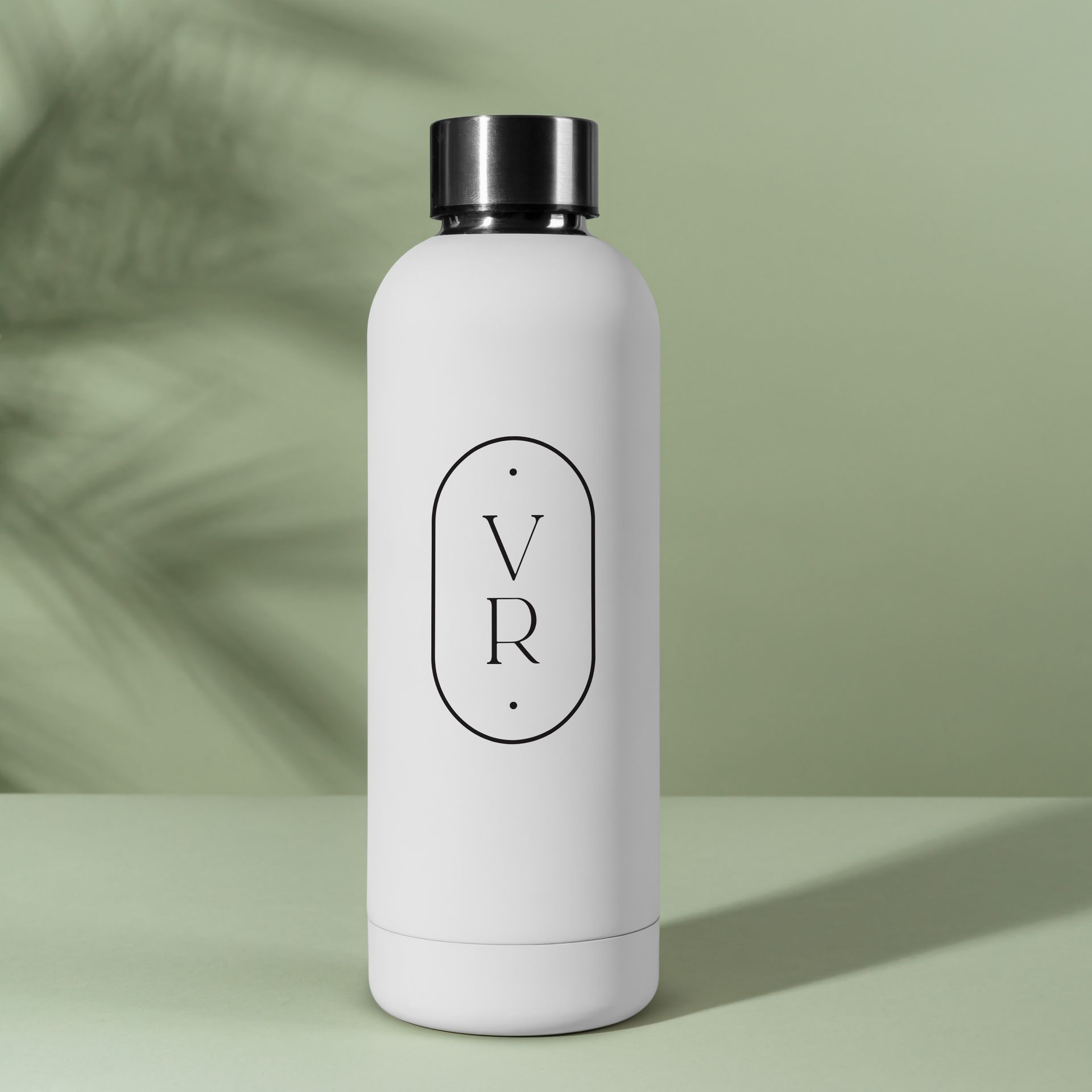 A white water bottle with the letter v and r on it